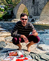Billy Daniels picnics by a river
