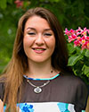 Meagan Shelley stands with flowers
